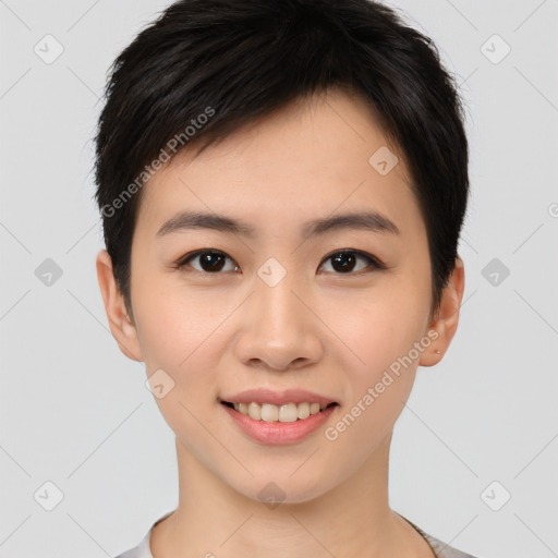 Joyful asian young-adult female with short  brown hair and brown eyes