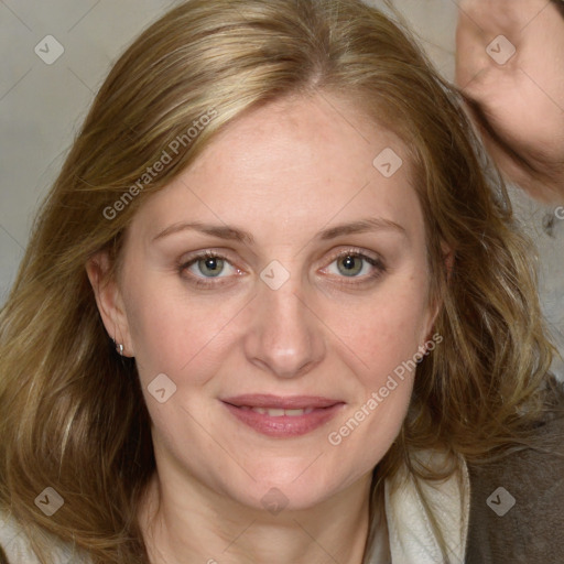 Joyful white adult female with medium  brown hair and blue eyes