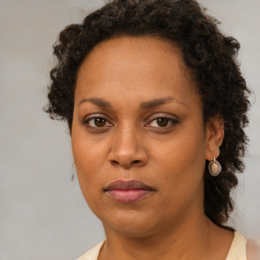 Neutral black adult female with short  brown hair and brown eyes