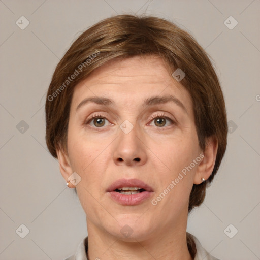 Joyful white adult female with short  brown hair and grey eyes