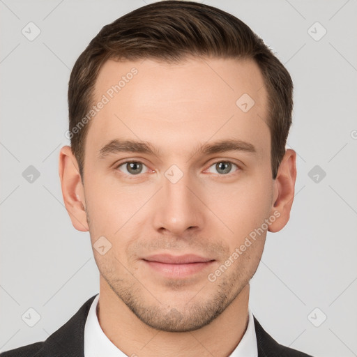 Joyful white young-adult male with short  brown hair and grey eyes