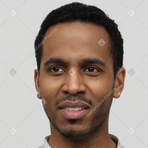 Joyful black young-adult male with short  black hair and brown eyes