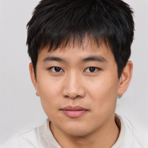Neutral asian young-adult male with short  brown hair and brown eyes