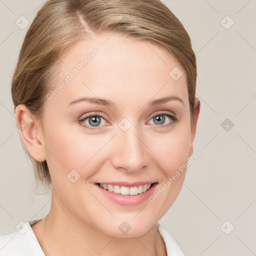 Joyful white young-adult female with medium  brown hair and blue eyes