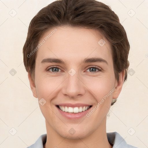 Joyful white young-adult female with short  brown hair and grey eyes