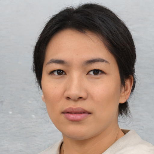 Neutral asian young-adult female with medium  brown hair and brown eyes