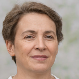 Joyful white middle-aged female with short  brown hair and brown eyes