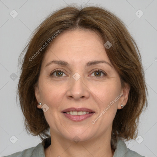 Joyful white adult female with medium  brown hair and grey eyes