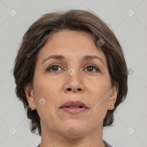 Joyful white adult female with medium  brown hair and brown eyes