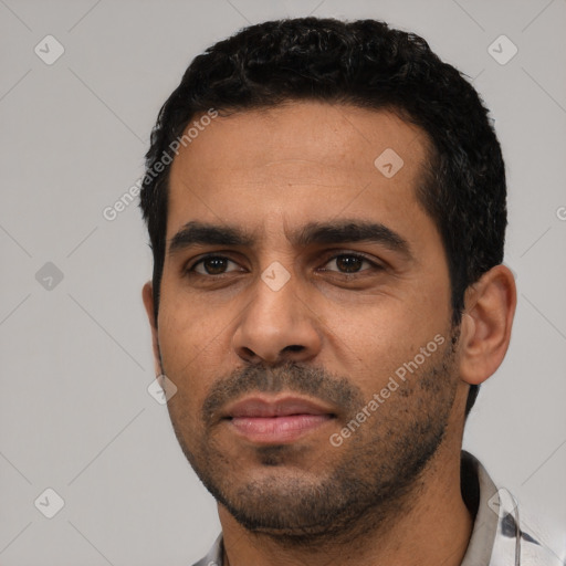 Neutral latino young-adult male with short  black hair and brown eyes