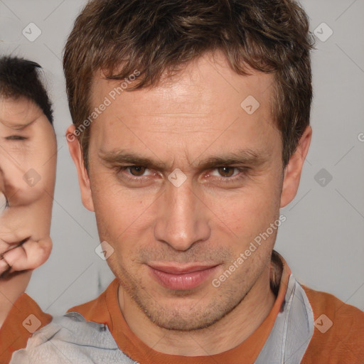 Joyful white adult male with short  brown hair and brown eyes