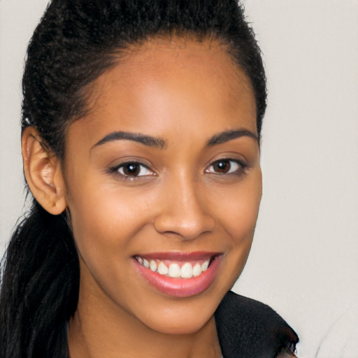 Joyful latino young-adult female with long  brown hair and brown eyes