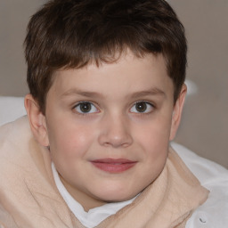 Joyful white child male with short  brown hair and brown eyes