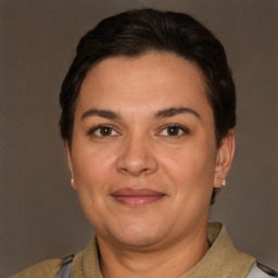 Joyful white adult female with short  brown hair and brown eyes