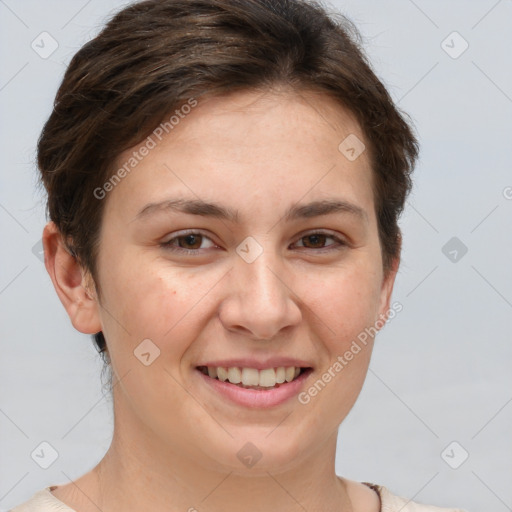 Joyful white young-adult female with short  brown hair and grey eyes