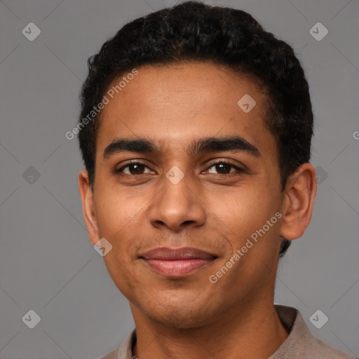 Joyful latino young-adult male with short  brown hair and brown eyes