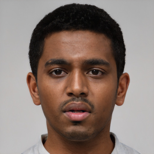 Neutral black young-adult male with short  black hair and brown eyes