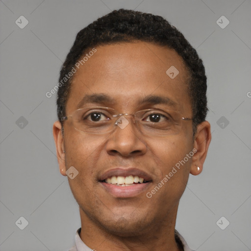 Joyful black adult male with short  black hair and brown eyes