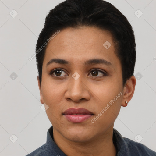 Joyful latino young-adult female with short  black hair and brown eyes