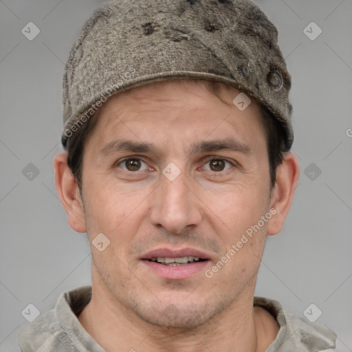 Joyful white adult male with short  brown hair and grey eyes