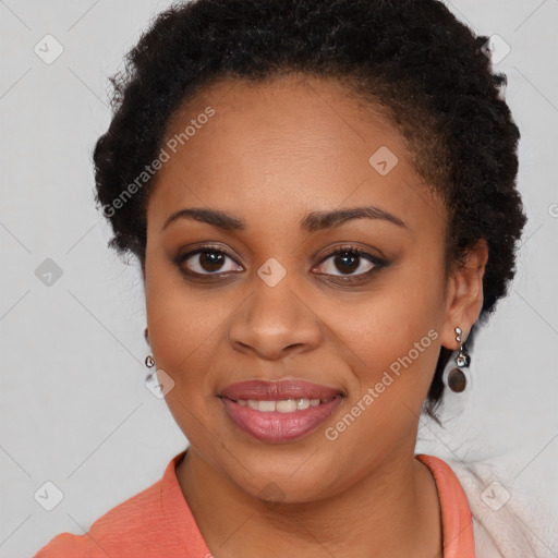 Joyful black young-adult female with long  brown hair and brown eyes