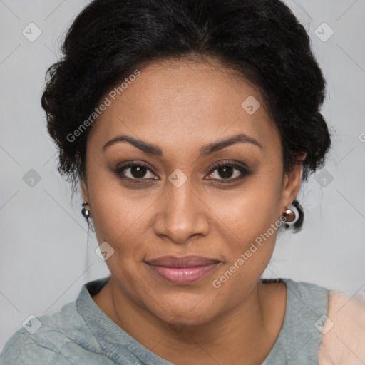 Joyful black adult female with medium  brown hair and brown eyes