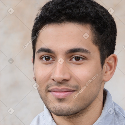 Joyful white young-adult male with short  black hair and brown eyes