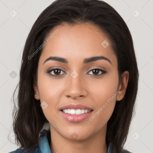 Joyful latino young-adult female with long  brown hair and brown eyes