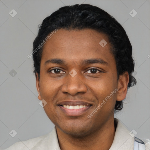 Joyful latino young-adult male with short  black hair and brown eyes