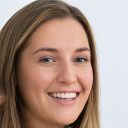 Joyful white young-adult female with long  brown hair and green eyes