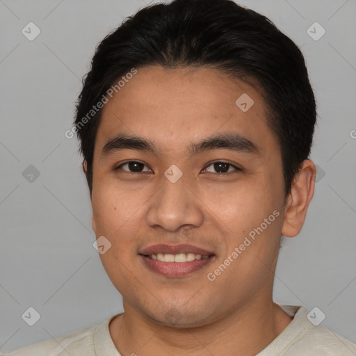 Joyful asian young-adult male with short  black hair and brown eyes