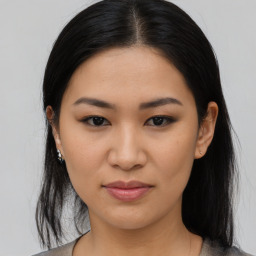 Joyful asian young-adult female with medium  black hair and brown eyes