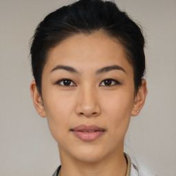 Joyful asian young-adult female with short  brown hair and brown eyes