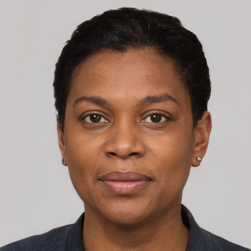 Joyful black adult female with short  black hair and brown eyes