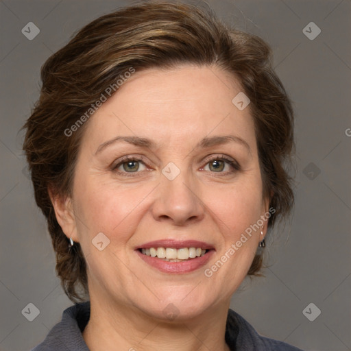 Joyful white adult female with medium  brown hair and grey eyes