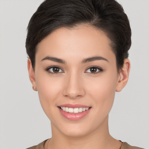 Joyful white young-adult female with short  brown hair and brown eyes