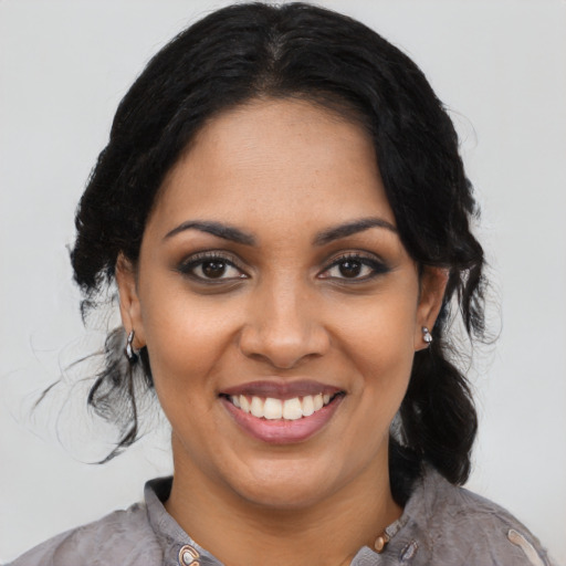 Joyful latino young-adult female with medium  black hair and brown eyes