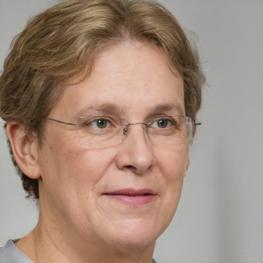 Joyful white middle-aged female with short  brown hair and brown eyes