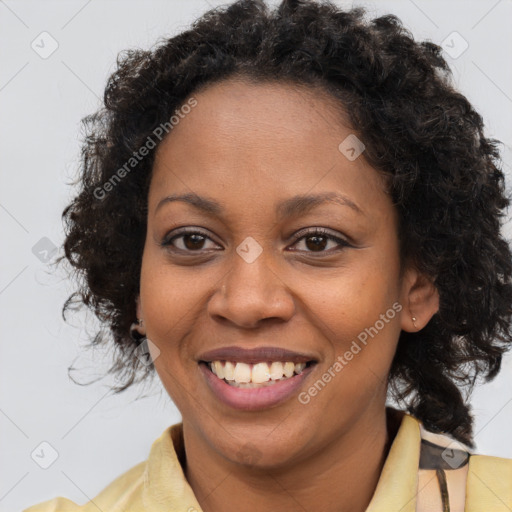 Joyful black young-adult female with medium  brown hair and brown eyes