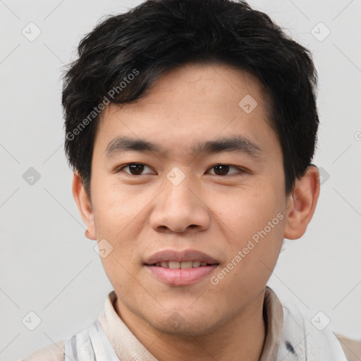 Joyful asian young-adult male with short  brown hair and brown eyes