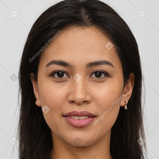 Joyful latino young-adult female with long  brown hair and brown eyes