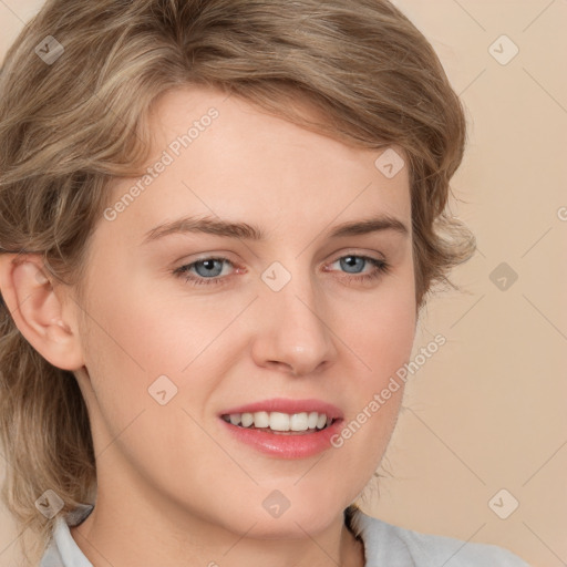 Joyful white young-adult female with medium  brown hair and blue eyes