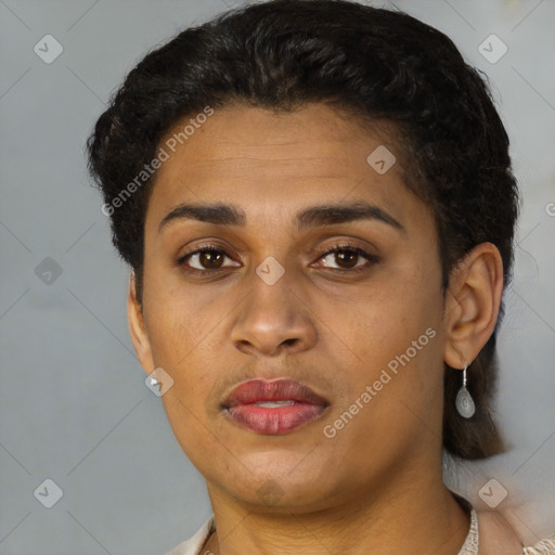 Joyful latino young-adult female with short  brown hair and brown eyes