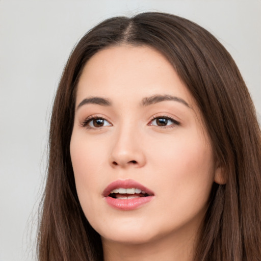 Neutral white young-adult female with long  brown hair and brown eyes