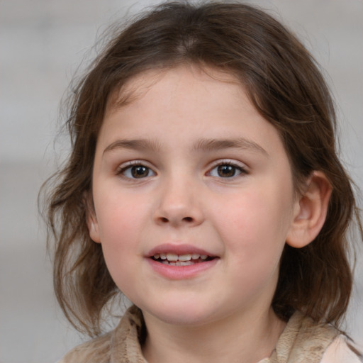 Joyful white child female with medium  brown hair and brown eyes