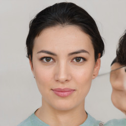 Joyful asian young-adult female with medium  brown hair and brown eyes