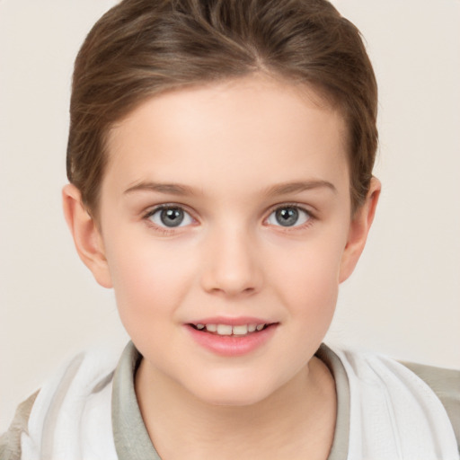 Joyful white child female with short  brown hair and brown eyes