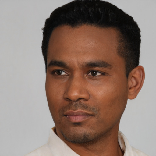 Neutral black young-adult male with short  black hair and brown eyes
