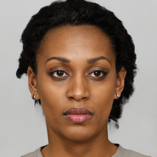 Neutral black young-adult female with short  black hair and brown eyes