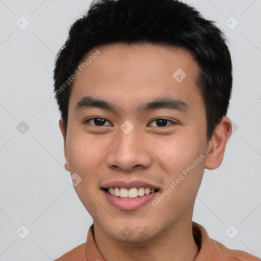 Joyful white young-adult male with short  black hair and brown eyes